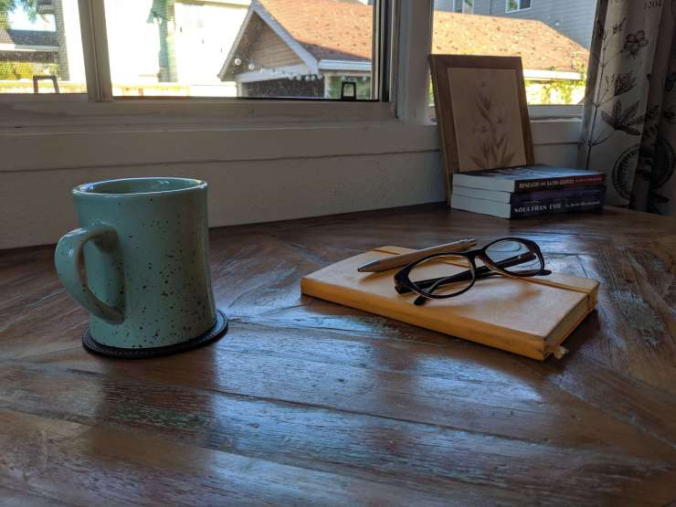 journal with mug and glasses