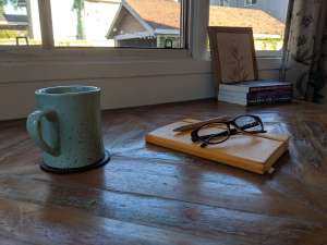 journal with mug and glasses